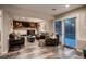 Spacious living room featuring a fireplace and sliding glass door to the exterior at 5611 W Bates Ave, Denver, CO 80227