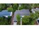 Aerial view of the home featuring a lush backyard with mature trees and a convenient carport at 3018 S Cherry Way, Denver, CO 80222