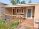Cozy covered back porch with outdoor furniture and string lights at 3018 S Cherry Way, Denver, CO 80222