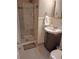 Bathroom features a walk-in shower and a vanity with dark wood cabinet and granite countertop at 3018 S Cherry Way, Denver, CO 80222