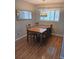 Cozy dining room features a wooden table with four chairs and a window at 3018 S Cherry Way, Denver, CO 80222