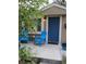 Inviting front porch with blue chairs, perfect for enjoying the outdoors and neighborhood views at 3018 S Cherry Way, Denver, CO 80222