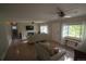 Bright and airy living area with hardwood floors, a fireplace, and ample natural light at 3018 S Cherry Way, Denver, CO 80222