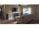 Inviting living room featuring a fireplace, built-in storage, and plenty of comfortable seating space at 3018 S Cherry Way, Denver, CO 80222