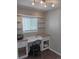 Bright office space with a built-in desk, shelving, chair, and natural light at 3018 S Cherry Way, Denver, CO 80222