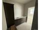 Double vanity bathroom with dark brown cabinets and white countertop at 6643 W 52Nd Ave # C, Arvada, CO 80002