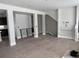 Open living room with hardwood floors and a staircase at 6643 W 52Nd Ave # C, Arvada, CO 80002