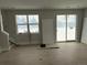 Living room with sliding glass doors and hardwood floor at 6643 W 52Nd Ave # C, Arvada, CO 80002