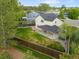 Backyard featuring a lush lawn, a fire pit, patio, privacy fence and shade trees at 9898 Tourmaline Ct, Parker, CO 80134