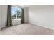 Bedroom featuring carpet flooring, natural light, and green curtains at 9898 Tourmaline Ct, Parker, CO 80134