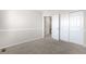 Cozy bedroom with neutral carpet, trim, and large closet at 9898 Tourmaline Ct, Parker, CO 80134