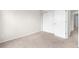 Cozy bedroom features carpet flooring, white walls and a closet with double doors at 9898 Tourmaline Ct, Parker, CO 80134
