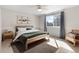 Cozy bedroom with soft carpet, natural light, and decorative art at 9898 Tourmaline Ct, Parker, CO 80134
