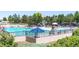 Community pool with lifeguard, sunshades and lounging areas at 9898 Tourmaline Ct, Parker, CO 80134