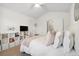 Airy bedroom featuring a ceiling fan, light walls, and stylish decor at 1761 S Buchanan Cir, Aurora, CO 80018
