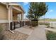 Inviting home with a stone facade, covered porch, and professional landscaping for great curb appeal at 1761 S Buchanan Cir, Aurora, CO 80018