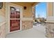 Inviting front porch with stone accents and outdoor seating area at 1761 S Buchanan Cir, Aurora, CO 80018