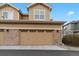 Attached two-car garage with stone accents and neutral color at 1761 S Buchanan Cir, Aurora, CO 80018
