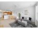 Open floor plan with dining area, comfortable seating, and bright natural light at 1761 S Buchanan Cir, Aurora, CO 80018