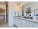 Elegant bathroom with double vanity, large mirror, and walk-in shower at 388 E Orchard Rd, Centennial, CO 80121