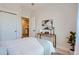 Comfortable bedroom with window, tasteful decor, and ensuite access at 388 E Orchard Rd, Centennial, CO 80121