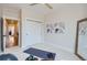 Bright bedroom with large window, closet, and hardwood floors at 388 E Orchard Rd, Centennial, CO 80121