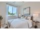 Serene bedroom with window, neutral decor, and ample light at 388 E Orchard Rd, Centennial, CO 80121