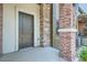 Inviting front entrance with brick detailing and a modern door at 388 E Orchard Rd, Centennial, CO 80121
