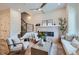 Open living room showcasing a cozy fireplace and ample natural light at 388 E Orchard Rd, Centennial, CO 80121