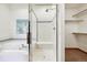 Bathroom with glass enclosed shower, soaking tub, and walk-in closet offers a luxurious retreat at 1024 Cottonwood Cir, Golden, CO 80401