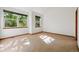 Sunlit bedroom featuring large windows and neutral carpet flooring at 1024 Cottonwood Cir, Golden, CO 80401