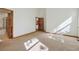 Spacious bedroom features carpet flooring, ensuite bathroom, and ample natural light at 1024 Cottonwood Cir, Golden, CO 80401