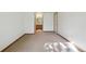 Spacious bedroom features an ensuite bathroom and carpet flooring at 1024 Cottonwood Cir, Golden, CO 80401