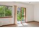 Cozy bedroom with a view of a private patio accessible through a sliding glass door at 1024 Cottonwood Cir, Golden, CO 80401