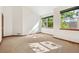Bedroom with large windows, neutral colored carpet and bright, natural light at 1024 Cottonwood Cir, Golden, CO 80401