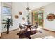 Breakfast nook with a slider to the deck, large windows, and views of the backyard at 1024 Cottonwood Cir, Golden, CO 80401