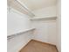 Walk-in closet with built-in shelving providing ample storage space at 1024 Cottonwood Cir, Golden, CO 80401