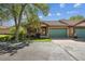 Exterior view with stucco siding, and a well-manicured front yard at 1024 Cottonwood Cir, Golden, CO 80401