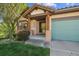 Inviting front entrance with custom wood columns and a charming tiled roof at 1024 Cottonwood Cir, Golden, CO 80401