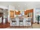 Kitchen featuring light wood cabinets, stainless steel fridge and a three-seat breakfast bar at 1024 Cottonwood Cir, Golden, CO 80401