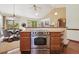The open kitchen features stainless steel appliances and easy access to the breakfast nook at 1024 Cottonwood Cir, Golden, CO 80401
