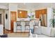 A modern kitchen features light wood cabinets, stainless steel appliances and a breakfast bar at 1024 Cottonwood Cir, Golden, CO 80401