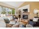 Cozy living room with a fireplace and abundant natural light at 1024 Cottonwood Cir, Golden, CO 80401
