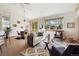 Inviting living room with dining space featuring a fireplace and large windows at 1024 Cottonwood Cir, Golden, CO 80401