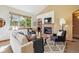 Bright living room featuring a cozy fireplace and stylish decor at 1024 Cottonwood Cir, Golden, CO 80401