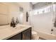 Bathroom with a white vanity, stylish mirror, mosaic tile accents and a shower with curtain at 19 S 45Th Ave, Brighton, CO 80601