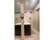 This bathroom has dual sinks, clerestory windows, and bright lighting, creating a functional and modern space at 19 S 45Th Ave, Brighton, CO 80601