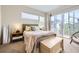Cozy bedroom with soft natural lighting, sliding glass doors, and a neutral color palette at 19 S 45Th Ave, Brighton, CO 80601
