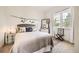 Cozy bedroom with a rattan headboard, soft colors, and natural light at 19 S 45Th Ave, Brighton, CO 80601