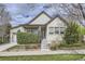 Charming home with manicured lawn, flowering shrubbery, concrete stairs and inviting front porch at 19 S 45Th Ave, Brighton, CO 80601